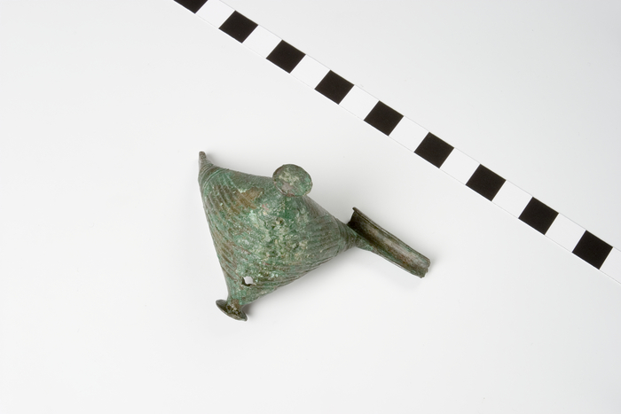 Bronze boat brooch with arched, hollow boat that swells out to form two lateral ...